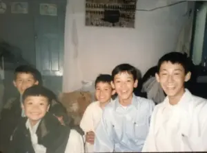 Abdul during childhood in Afghanistan with siblings
